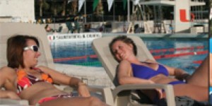 Australian exhange students, Carly Mills and Caitlin Judd enjoy the Miami sun and relaz at the pool.