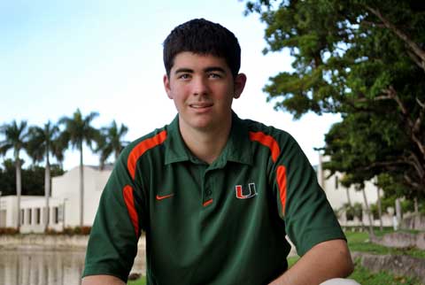 CAT. FIVE: Brandon Mitchell poses by lake Osceola.
