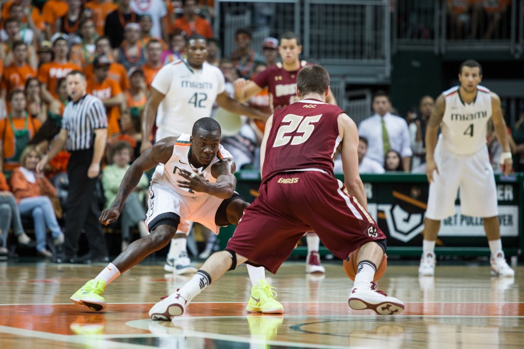 CORAL GABLES, FLA. -- Feb. 5, 2013: Senior guard Durand Scott defends Boston College's Joe Rahon. (Photo by Zach Beeker)